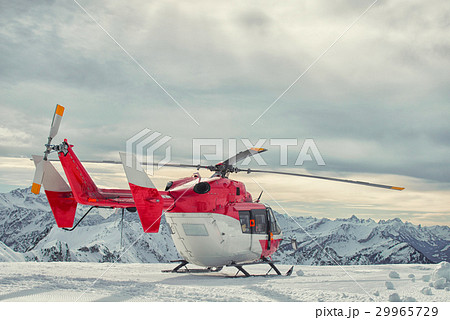 Helicopter mountain rescue service in the winter 29965729