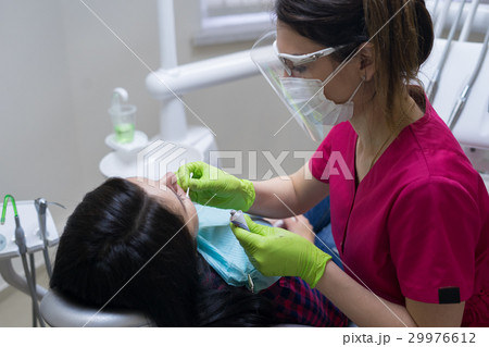 female patient at dentist in the clinic 29976612