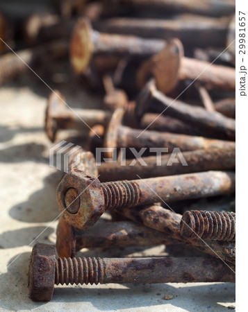 group of old rusty nuts and bolts on the floor group of old rusty nuts and bolts on the floor 29981657