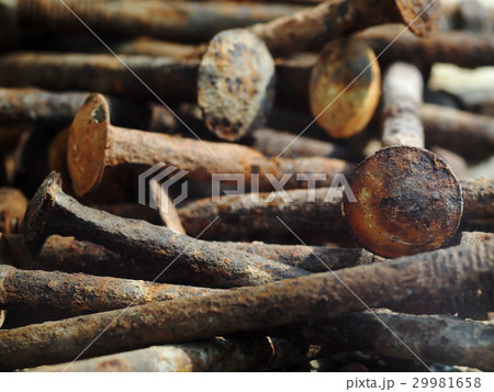 group of old rusty nuts and bolts on the floor group of old rusty nuts and bolts on the floor 29981658