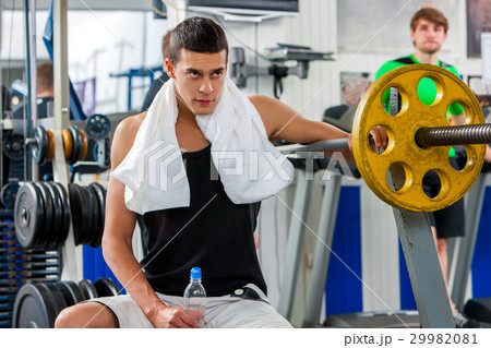 Fitness men friends in gym workout weights with Fitness men friends in gym workout weights with 29982081