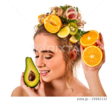 Hair mask from fresh fruits on woman head. Girl Hair mask from fresh fruits on woman head. Girl 29982132