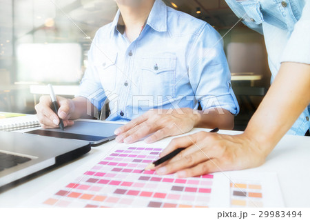 Graphic designer at work. Color swatch samples. Graphic designer at work. Color swatch samples. 29983494