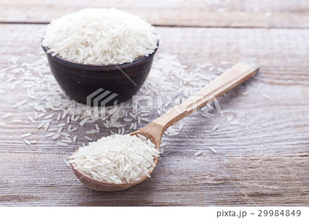 rice on a wooden background 29984849