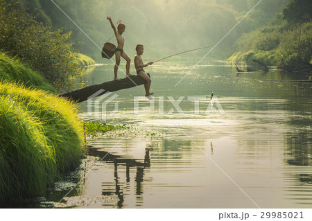 Boy fishing at the river Boy fishing at the river 29985021