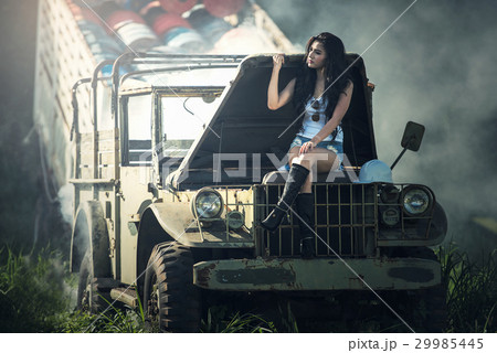 Asian model posing with old truck in an outdoor  29985445