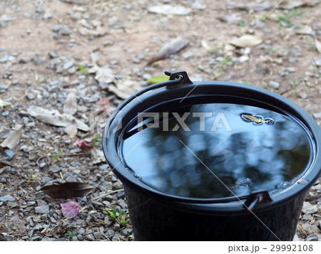 black plastic bucket on the floor outdoor black plastic bucket on the floor outdoor 29992108