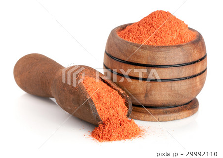 Ground paprika in a wooden bowl with a scoop Ground paprika in a wooden bowl with a scoop 29992110