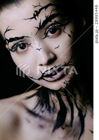 beautiful woman with creative make-up halloween 29995446