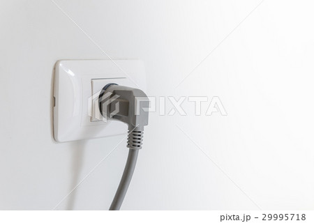 socket plug with electric plug line on white wall socket plug with electric plug line on white wall 29995718
