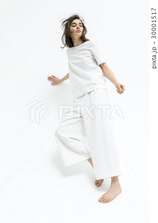 Girl posing in motion in studio 30001517