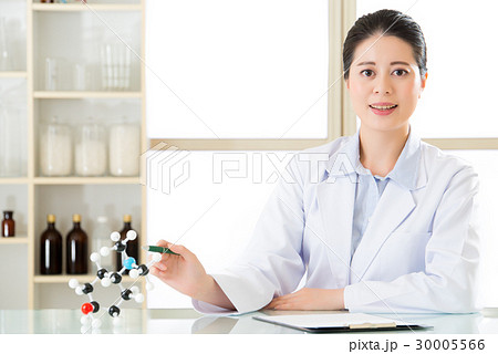 asian female chemist teacher point at molecular asian female chemist teacher point at molecular 30005566