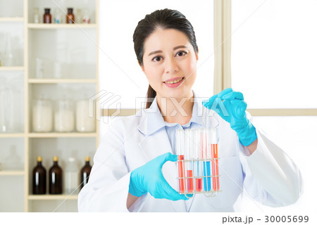 Asian female scientist researcher observing Asian female scientist researcher observing 30005699