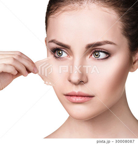 Woman remove her old dry skin from face. 30008087