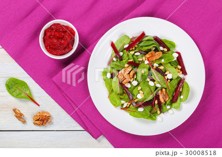 caramelized walnuts salad on white plate caramelized walnuts salad on white plate 30008518