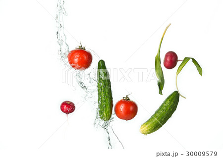 The fresh tomatos, cucumbers, radish in spray of The fresh tomatos, cucumbers, radish in spray of 30009579