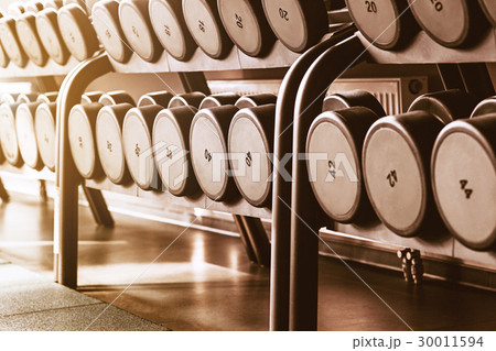 Rows of dumbbells in the gym Rows of dumbbells in the gym 30011594