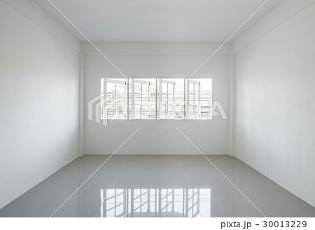 Empty light white room with windows Empty light white room with windows 30013229