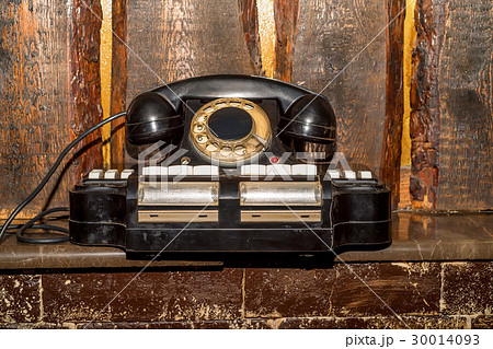 Vintage phoneon the bookshelf background Vintage phoneon the bookshelf background 30014093