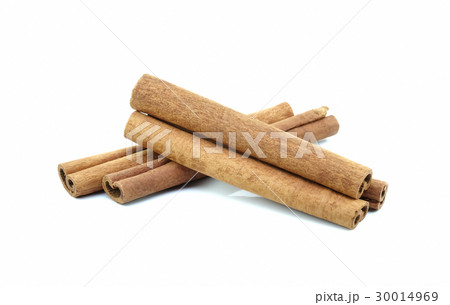 Cinnamon on white background. Cinnamon on white background. 30014969