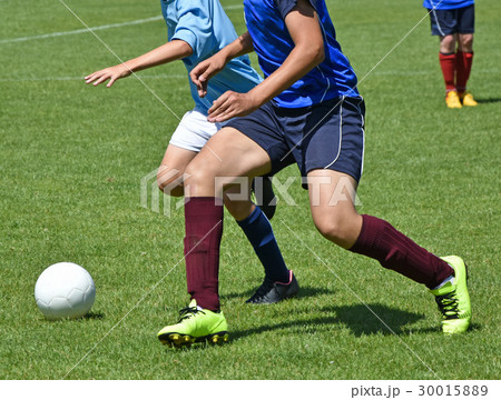 Young soccer players in action 30015889