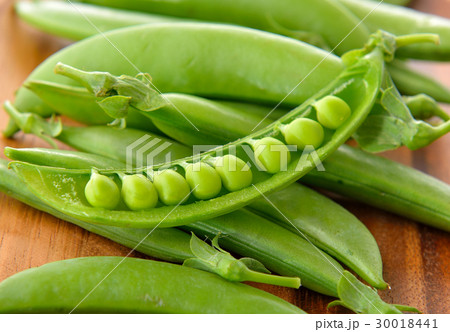 fresh green pea on wooden background fresh green pea on wooden background 30018441