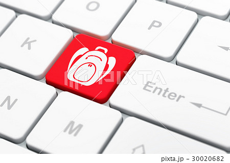 Tourism concept: Backpack on computer keyboard Tourism concept: Backpack on computer keyboard 30020682