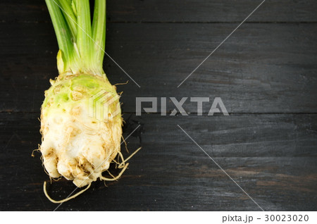 whole celery on a black table whole celery on a black table 30023020