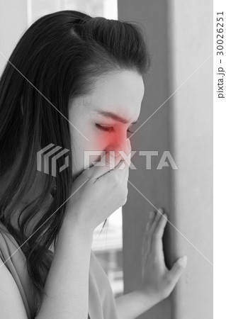 woman with cold or flu, running nose 30026251