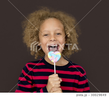 Little Boy Eating Lollipop Candy 30029649