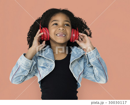 Little Girl Listening Music Headphones Studio Portrait 30030117