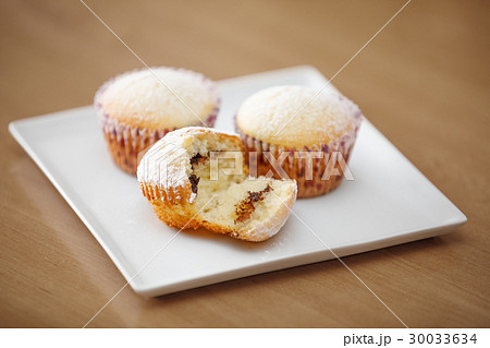 fresh homemade Muffin on wooden table fresh homemade Muffin on wooden table 30033634