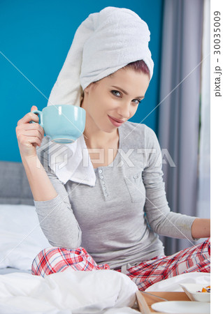 Portrait of a happy smiling european woman eating a healthy brea Portrait of a happy smiling european woman eating a healthy brea 30035009