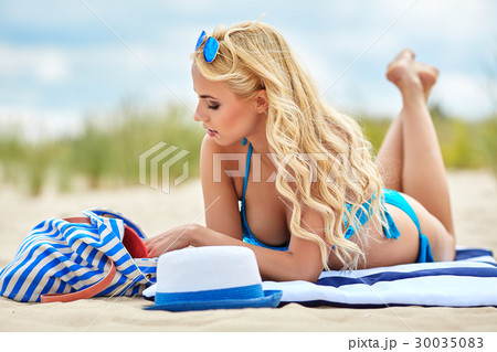 Woman with beautiful body on a baltic  beach Woman with beautiful body on a baltic  beach 30035083