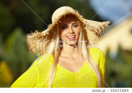 Close-up portrait of smiling female by the sea. Happy woman stan Close-up portrait of smiling female by the sea. Happy woman stan 30035884