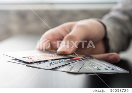 Male hands holding credit cards Male hands holding credit cards 30038726