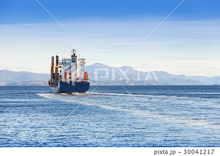 Container ship goes on Norwegian sea, rear view Container ship goes on Norwegian sea, rear view 30041217