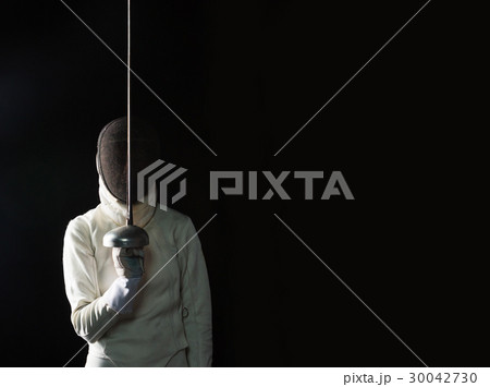 The portrait of woman wearing white fencing The portrait of woman wearing white fencing 30042730