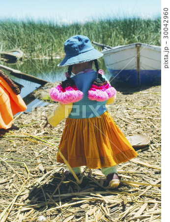 Aymara girl dressed in colorfull outfit, Peru 30042960