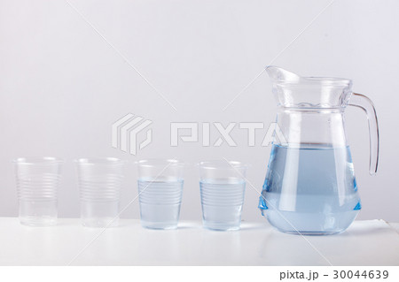 glass jug with water isolated on white background 30044639
