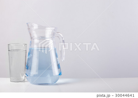 glass jug with water isolated on white background glass jug with water isolated on white background 30044641