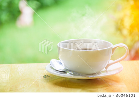 Morning coffee cup on wood table Morning coffee cup on wood table 30046101
