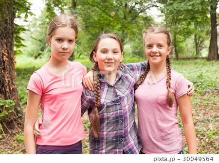 Two sisters hugs 30049564