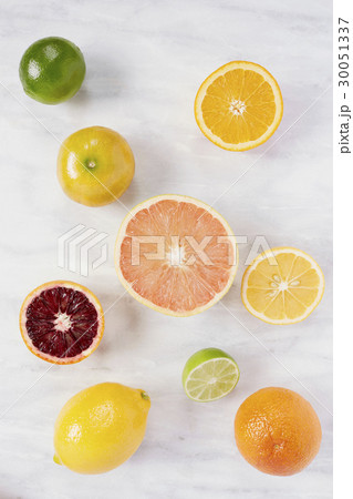 Various citrus fruits on marble counter Various citrus fruits on marble counter 30051337