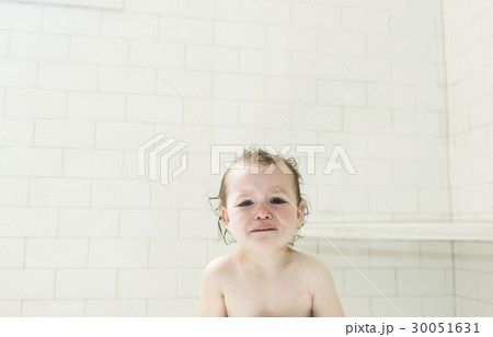 Sad boy (4-5) with wet hair in bathroom Sad boy (4-5) with wet hair in bathroom 30051631