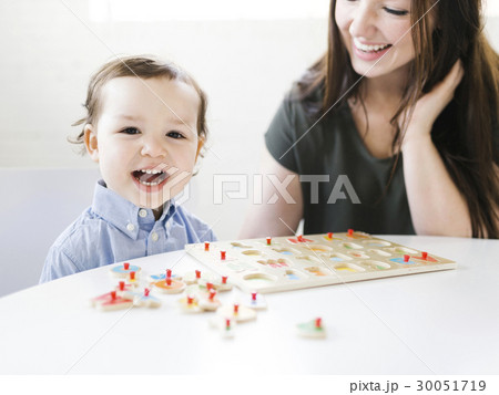 Mother playing alphabet game with son (4-5) 30051719