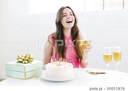 Portrait of woman at birthday party Portrait of woman at birthday party 30051876