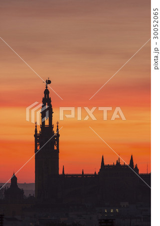 Spain, Seville, Silhouette of Giralda and Cathedral of Sevilla at sunset Spain, Seville, Silhouette of Giralda and Cathedral of Sevilla at sunset 30052065