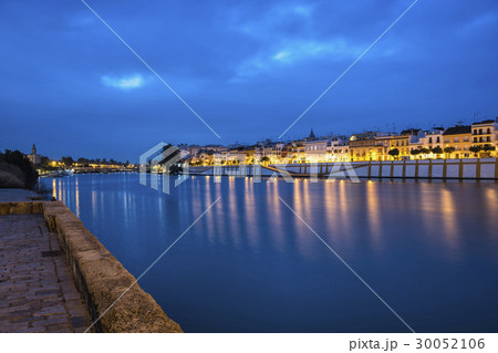 Spain, Seville, Triana, Guadalquivir river at dusk 30052106