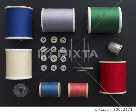 Studio shot of colorful sewing tools on black background 30052171